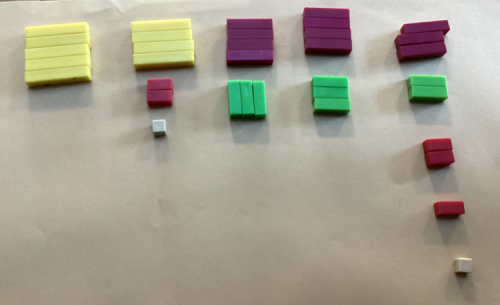 Image showing the solution above, with Cuisenaire rods representing the numbers.